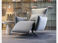 POLSE Upholstered tilting and swivelling armchair with metal base