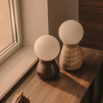 OKENI table lamp made of travertine and glass