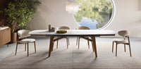 ABREY Table with an elliptical top and wooden legs