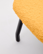 BELINA Footrest in mustard bouclé and steel with black finish