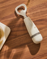 NIRA Opener in black and white marble