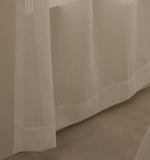 RILA curtain with detailed striped structure in off-white