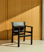 JAN Chair made of black recycled leather fibres and FSC 100% solid ash wood with black finish