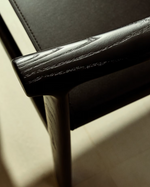 JAN Chair made of black recycled leather fibres and FSC 100% solid ash wood with black finish