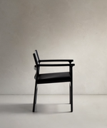 JAN Chair made of black recycled leather fibres and FSC 100% solid ash wood with black finish