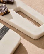 NIRA Small serving board in black and white marble