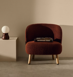 ULIT armchair in terracotta bouclé with solid beech wood legs in a natural finish