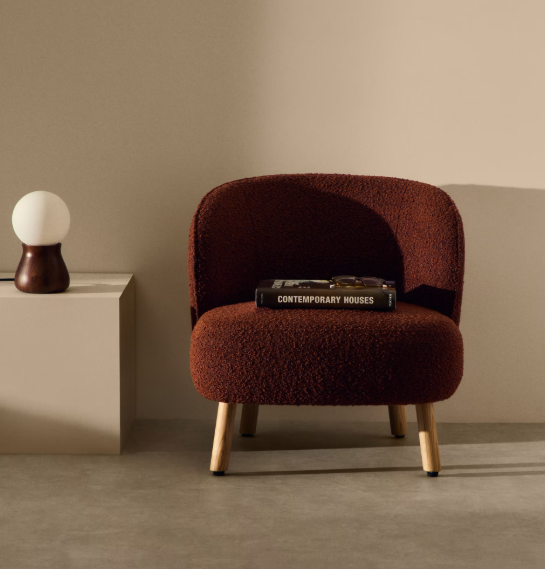 ULIT armchair in terracotta bouclé with solid beech wood legs in a natural finish