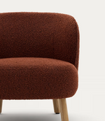 ULIT armchair in terracotta bouclé with solid beech wood legs in a natural finish