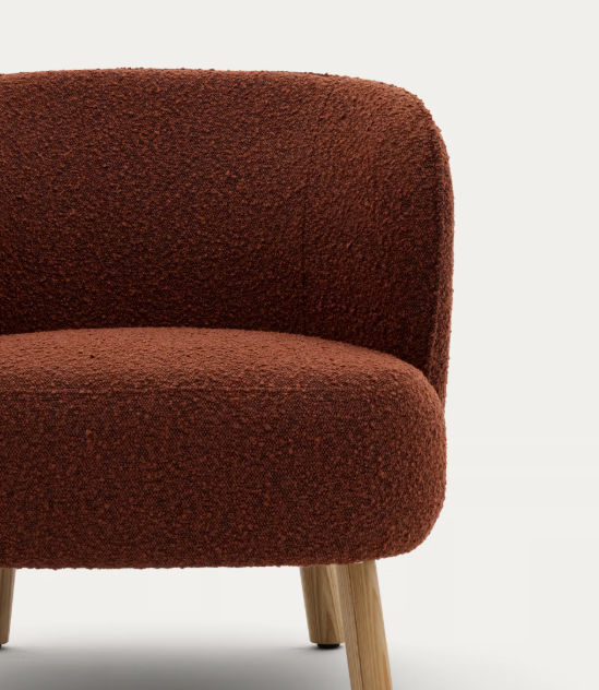 ULIT armchair in terracotta bouclé with solid beech wood legs in a natural finish