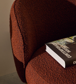 ULIT armchair in terracotta bouclé with solid beech wood legs in a natural finish