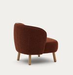 ULIT armchair in terracotta bouclé with solid beech wood legs in a natural finish