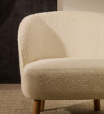 ULIT armchair in white bouclé with solid beech wood legs in a natural finish