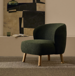 ULIT armchair in green chenille with solid beech wood legs in a natural finish