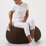 YUM YUM A soft padded pouf with a strong wooden backrest