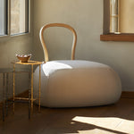 YUM YUM A soft padded pouf with a strong wooden backrest